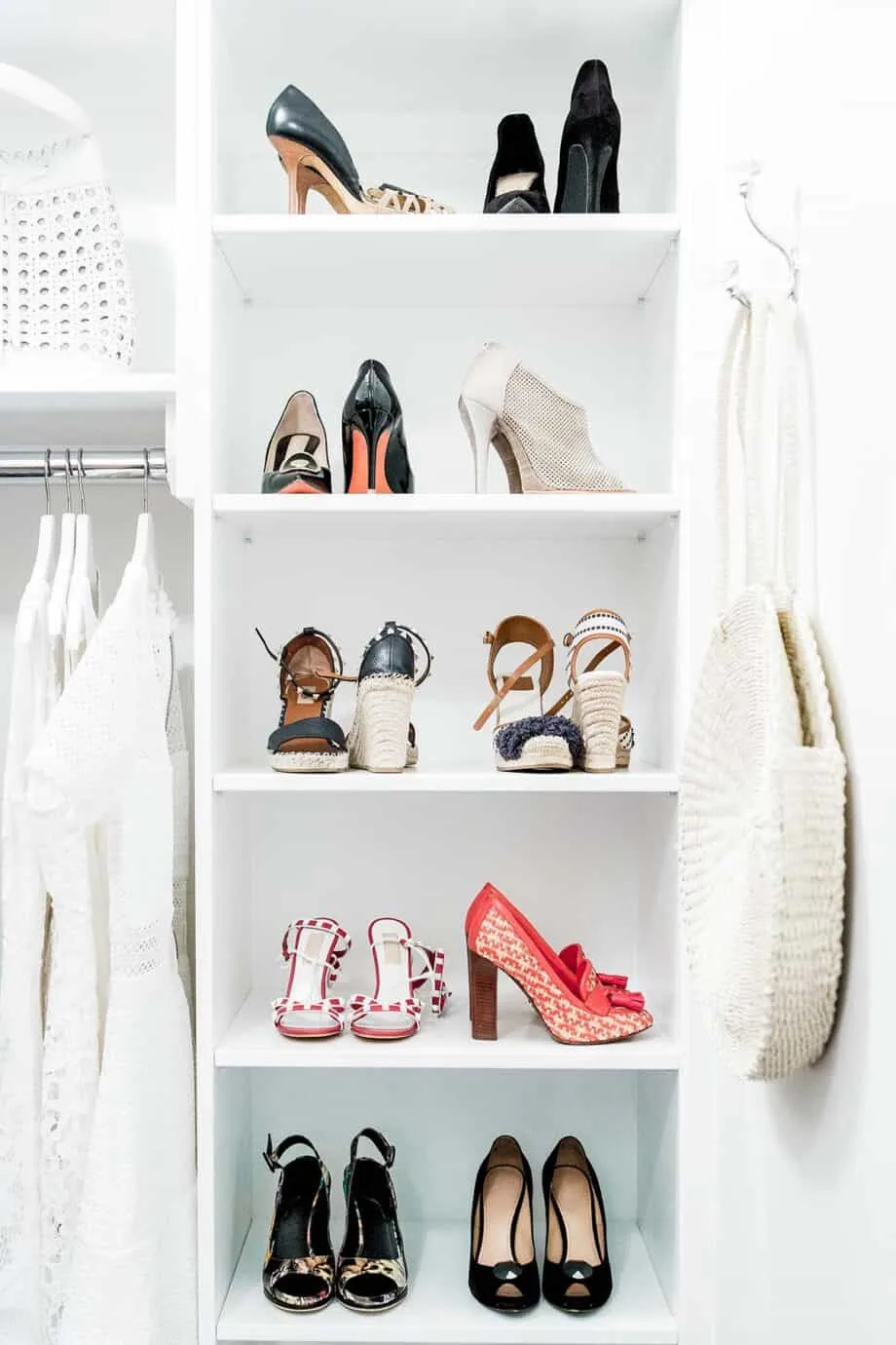 Inside of a wardrobe with shelves showing shoes